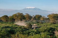 Angama-Amboseli-Safari-Vehicle-with-Mount-Kilimanjaro-photographed-by-Sammy-Njoroge