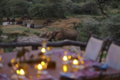 Bush-and-Beyond-Sarara-Camp-Main-Area-Dinner-Setup-With-Mud-Bath-View