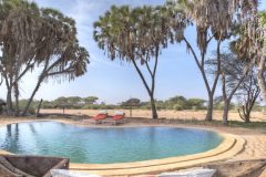 Saruni-Rhino-infinity-pool-along-dry-river-bed-Saruni