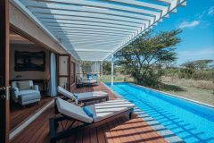 Swimming Pool

The expansive swimming pool stretches along the edge of the main deck, offering a refreshing place to relax between safari activities. Surrounded by comfortable loungers with a balance of sun and shade, it provides an inviting setting to cool off while enjoying the views of the surrounding Maasai Mara.